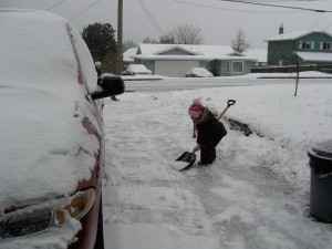 3 year old shovelling snow